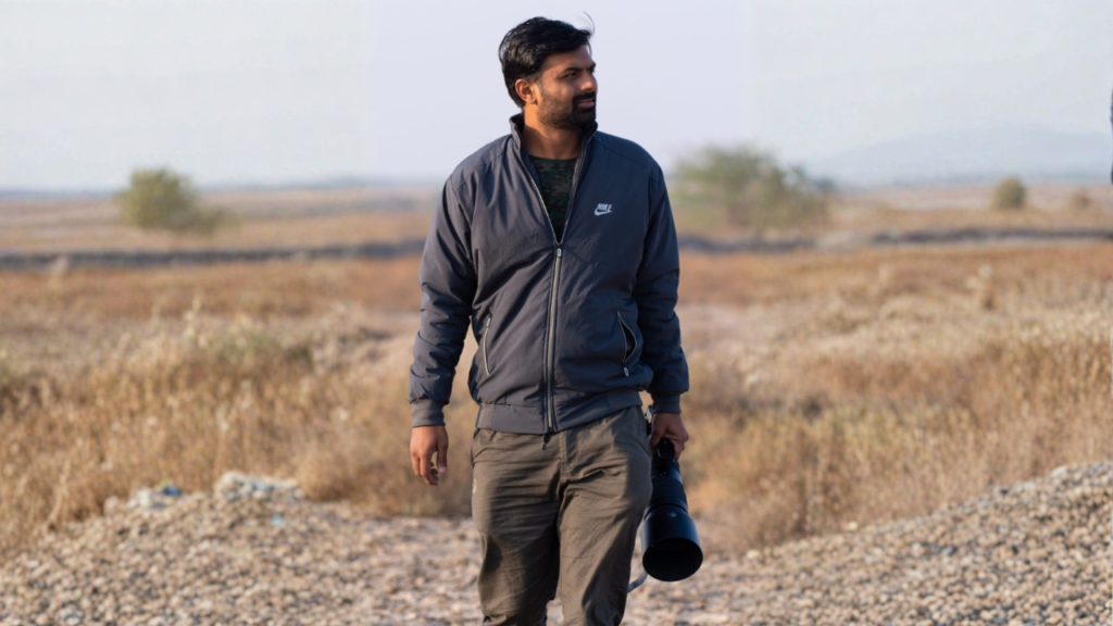 Hiteshkumar Patel holding a telephoto camera